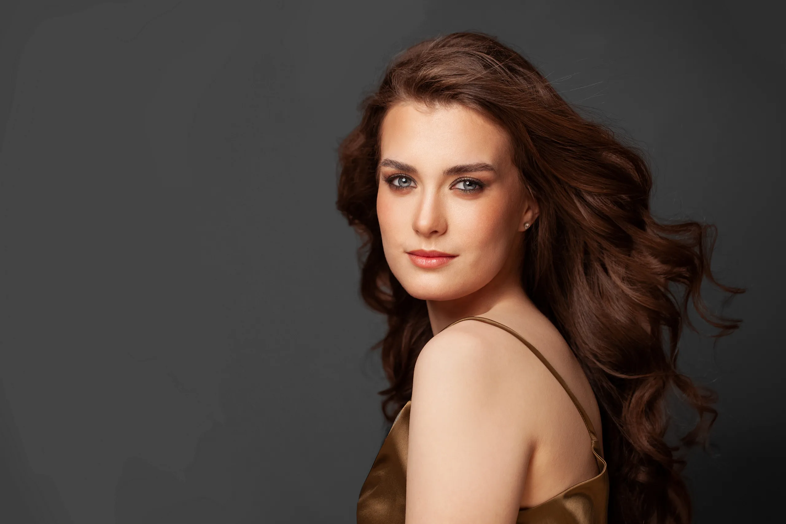Salon client with voluminous brunette waves